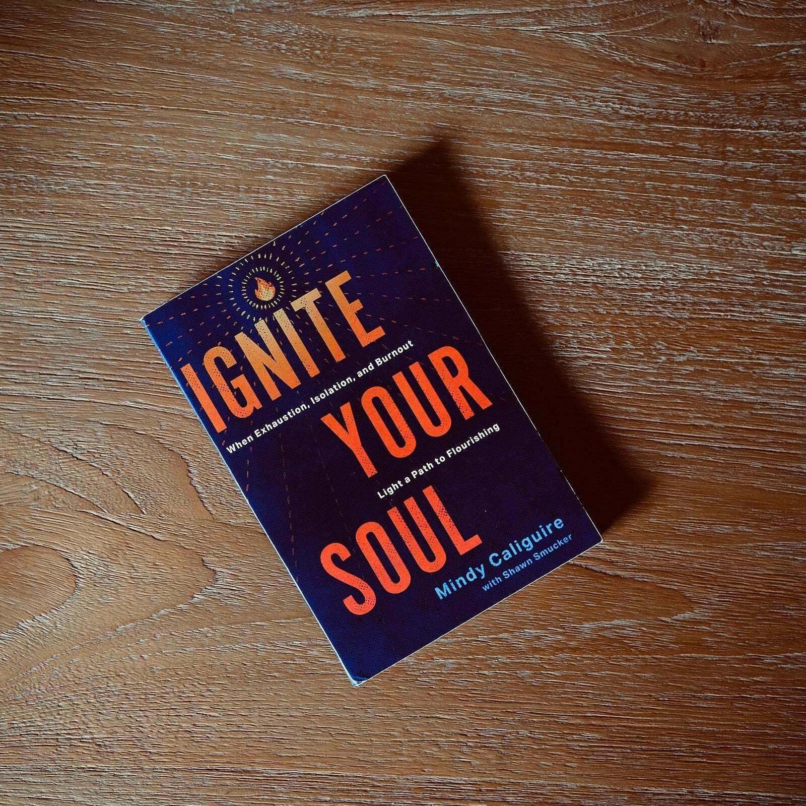 Ignite Your Soul by Mindy Caliguire on a wooden table